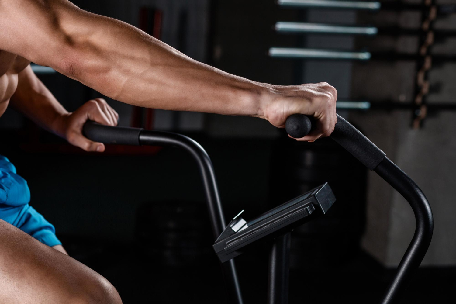 Certified spin instructor leading a high-energy class at Rumble Fitness